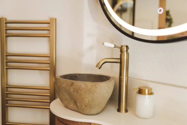 Stone basin with brass tap