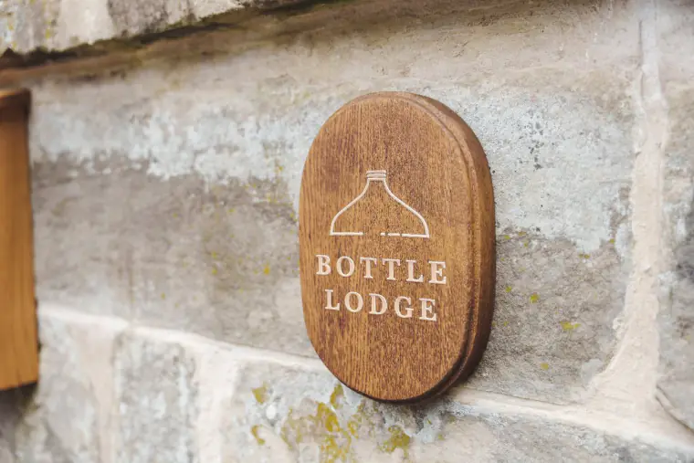 The carved Bottle Lodge sign