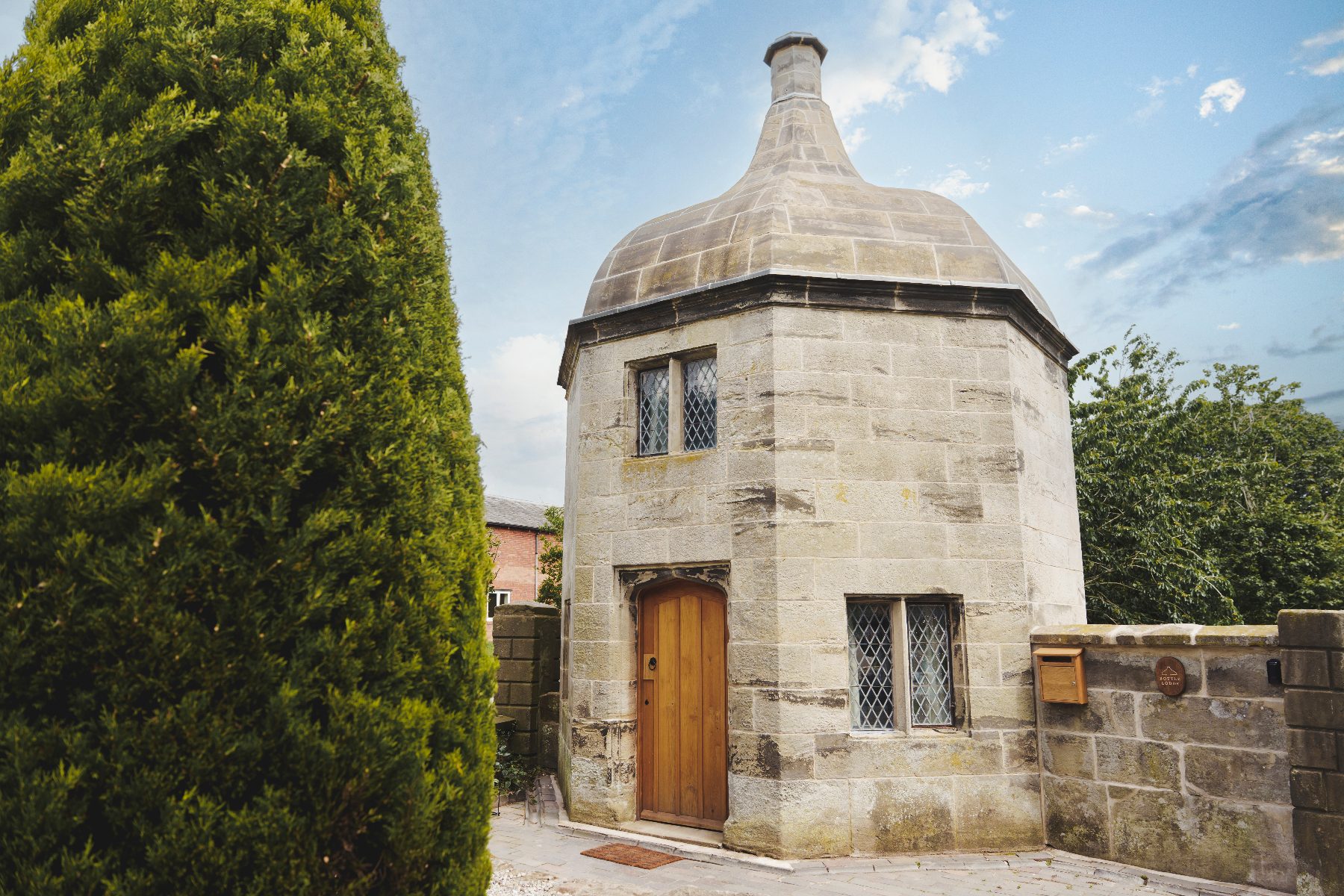 Bottle Lodge, an octagonal stone lodge with a domed roof at Tixall, Staffordshire