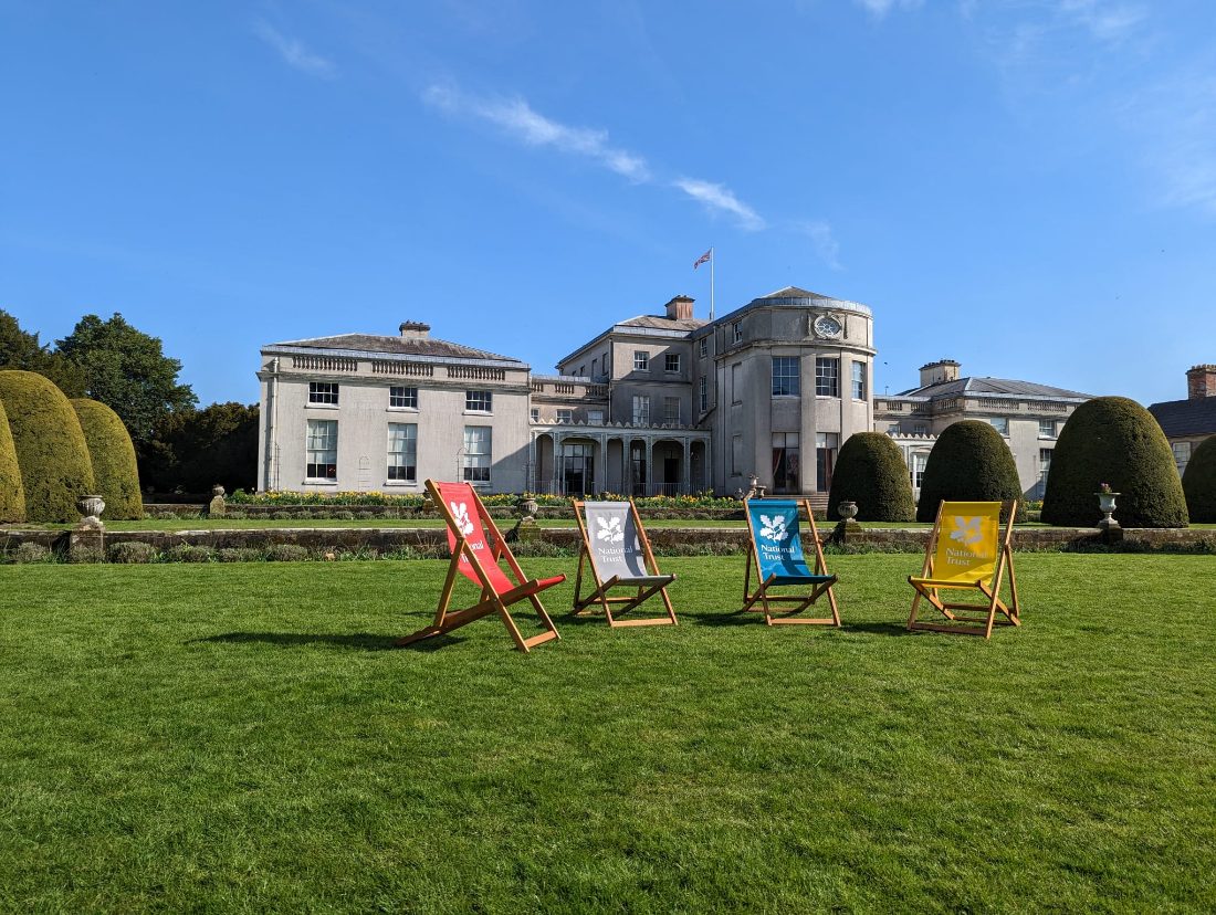 Shugborough Hall with National Trust deckchairs on the lawn